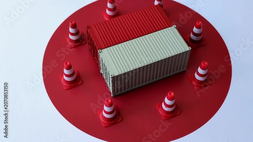 The cargo container ban on the japanese flag as a conceptual backdrop for the export and logistics of goods. The cargo container embargo on the japanese flag as a backdrop for your design