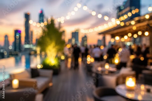 Blurred rooftop party sunset city skyline bokeh background luxury lounge event social gathering outdoor dinner ambiance nightlife urban scene