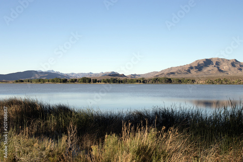 In early morning light, the Pahranagat Mountains reflect on the lake at Pahranagat National Wildlife Refuge in Nevada