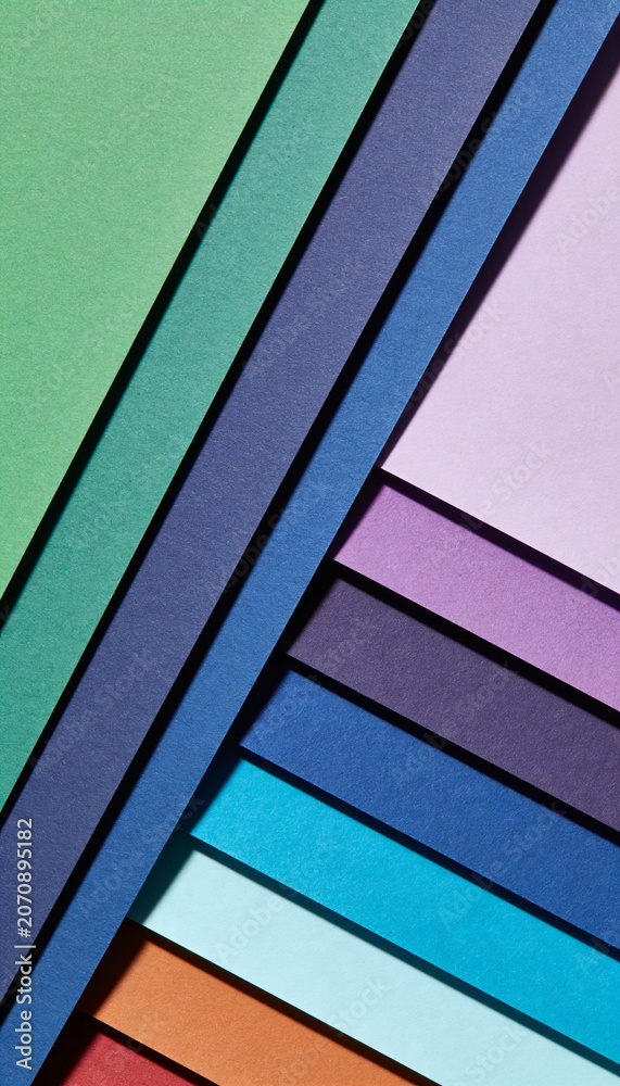 Fototapeta premium Abstract arrangement of colorful textured paper sheets creating a modern geometric design