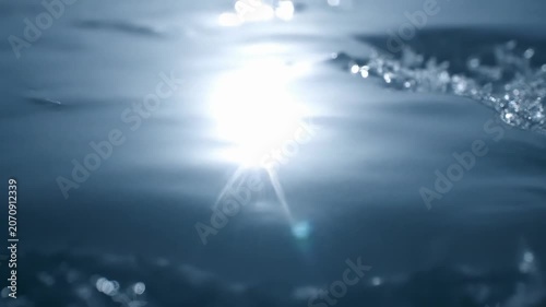 Slow Motion Water Splashing with Sparkling Light Effects