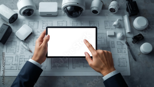 Smart home security system management with tablet mockup and large copy space for CCTV monitoring, surveillance technology, home protection, alarm systems, property security and business presentation