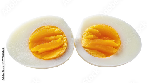 Fényképezés Isolated two halves of a hard-boiled egg cut longitudinally with bright yellow y