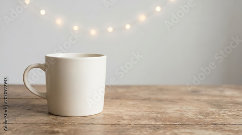 White coffee mug on rustic wooden table