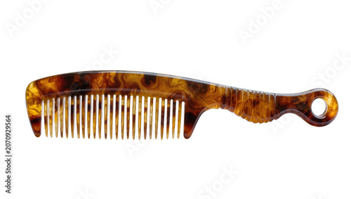 Photos Isolated elegant tortoiseshell hair comb with a curved handle and a hole for han