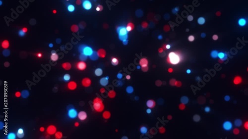 Bright red white and blue particles of light on a dark background, celebration animation
