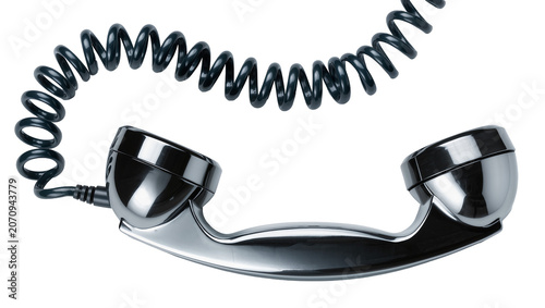 Fotografie Isolated retro telephone receiver with shiny metallic finish and curly cord for