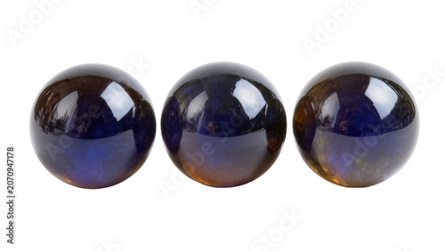 Photography Isolated group of three shiny dark iridescent orbs displaying colorful purple an