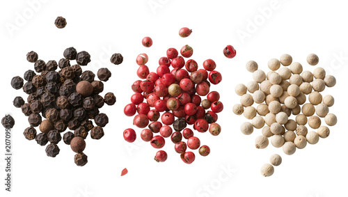 Schilderij op canvas Isolated black, red, and white peppercorns in a dynamic arrangement, culinary sp