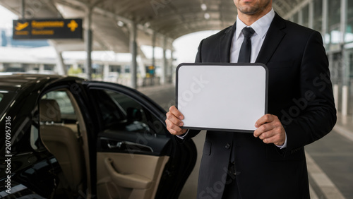 Airport pickup service chauffeur luxury car transfer welcome sign professional driver business travel arrival terminal modern transportation