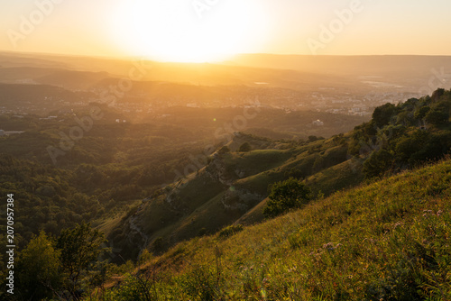 View of the mountains and Kislovodsk from the observation decks of the Kislovodsk Park. Evening sunset over the mountains of Kislovodsk.
