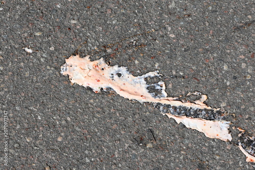 Foto Spilled ice cream or yoghurt on the ground. Messy stain.