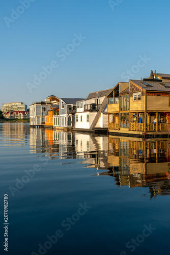 Colorful Fisherman's Wharf Floating Homes vertical. Colorful floating Houses boats at fisherman’s wharf on the Inner Harbor of Victoria, Canada. 
