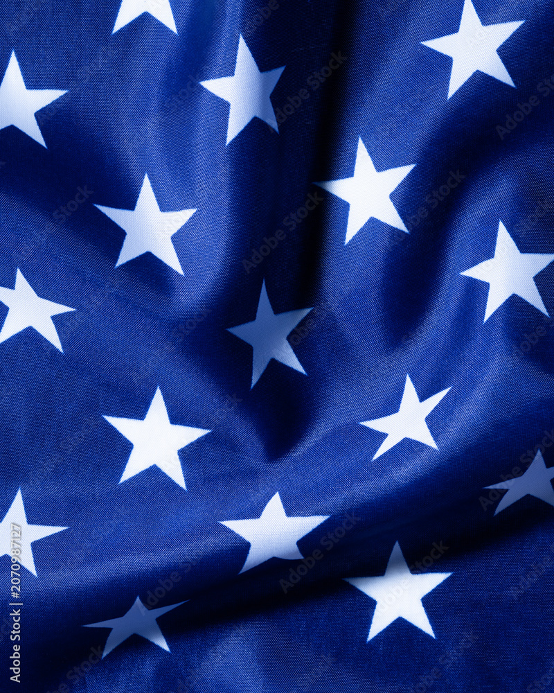 Fototapeta premium Patriotic blue american flag fabric with white stars texture