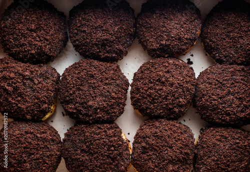 Set of donuts with chocolate on paper, donut background. Sweets, dessert and pastry, close up, top view