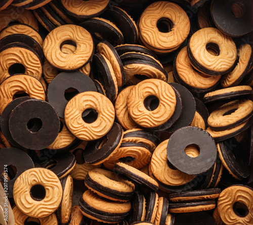 Chocolate ring cookies, cookie background. Sweets, dessert and pastry, close up, top view