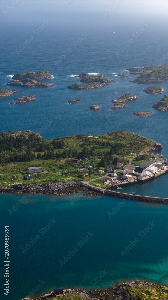 Naklejka premium Aerial View of Lofoten Islands Norway with Coastal Village and Rocky Archipelago