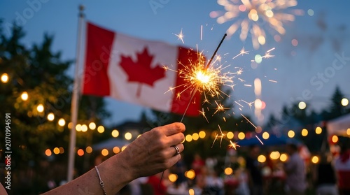 Hands Holding Burning Sparklers During Canada Day Celebration With Joyful Holiday Lighting And Patriotic Nighttime Event