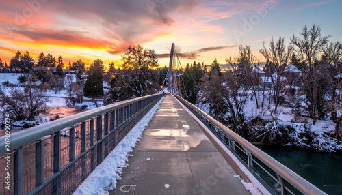 Scenic Winter Sunset Over Footbridge in Bend, Oregon.
