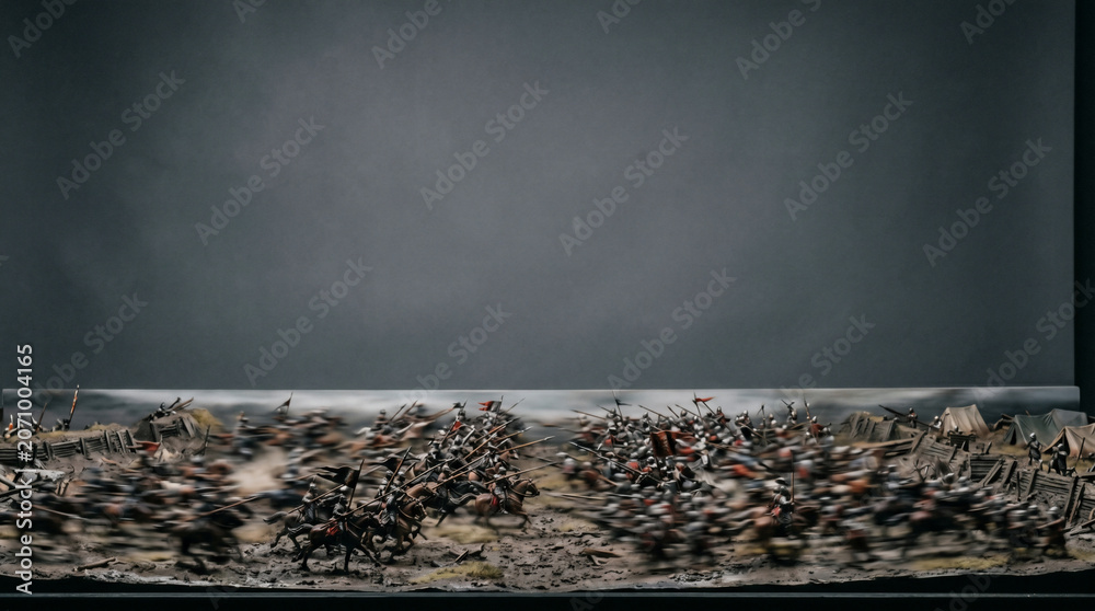 Fototapeta premium Epic Battle Scene: A chaotic and dramatic miniature diorama depicts a fierce historical battle with soldiers clashing in intense combat, showcasing the intensity and struggle of war.