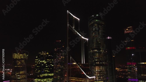 Drone flying backward from Moscow City skyscraper