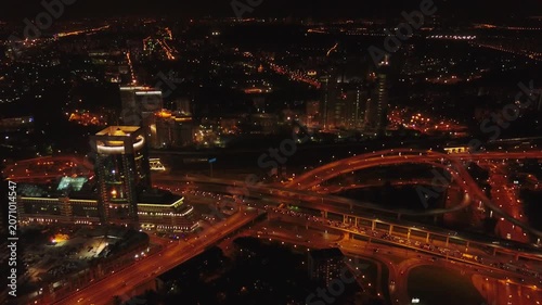 Night drone retreat and ascent over Moscow highways