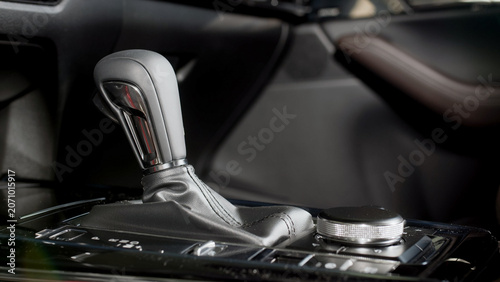 Fotografie Car interior featuring automatic transmission gear shift lever with leather boot