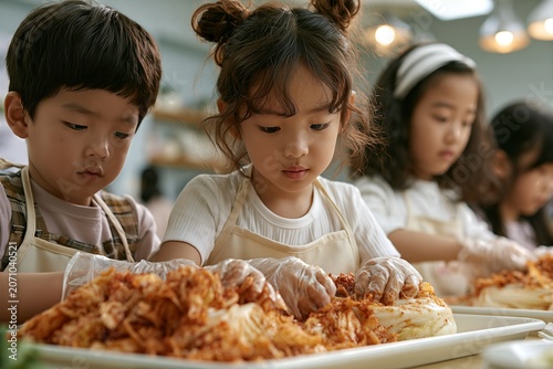 Korean children making kimchi together in hands on cooking class