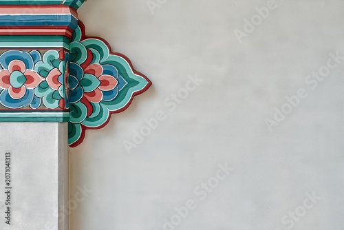Korean traditional dancheong pattern detail on white temple wall with copy space
