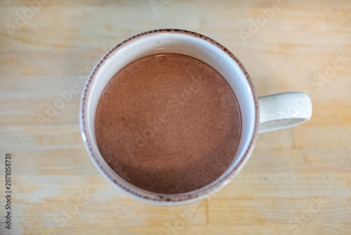 Принти на полотні Top view of a mug with a brown beverage