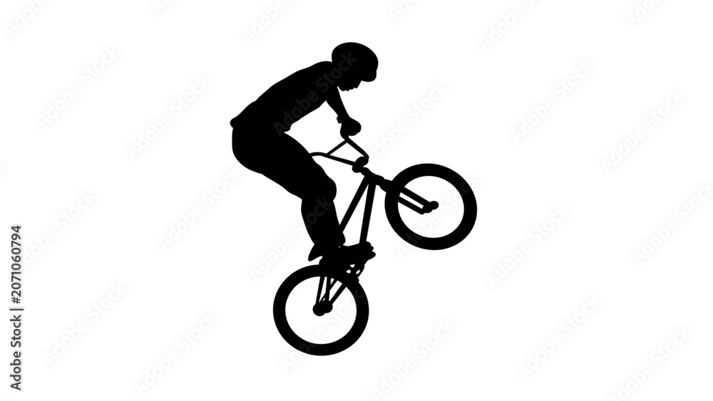 Fototapeta premium Silhouette of a bmx cyclist doing a manual wheelie stunt