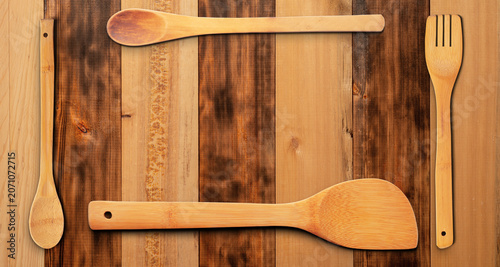 Wooden Utensils on Wooden Surface Background. File with Clipping Path.