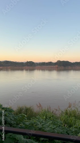 Golden hour reflection on Mekong River, Chiang Khan, Thailand 