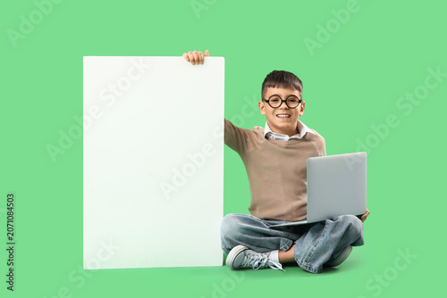 Little boy in eyeglasses wi...