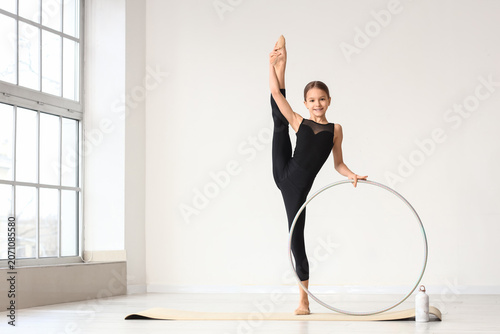 Cute girl with hula hoop do...