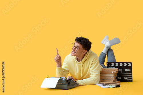 Male screenwriter with type...