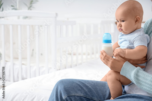 Mother with baby and bottle...