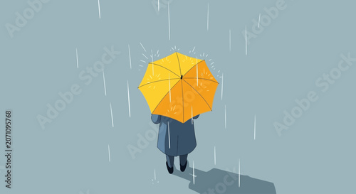 A person holding a bright yellow umbrella under a heavy downpour, seeking shelter from the rain