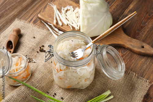 Glass jar with tasty sauerk...