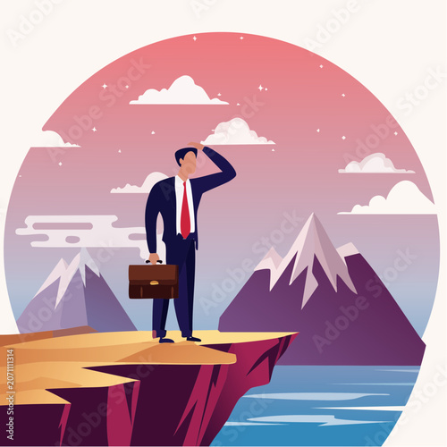 Businessman looking out from cliff edge at mountains and ocean