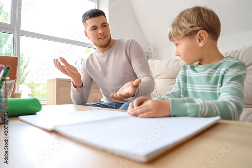 Father checking his sons ho...