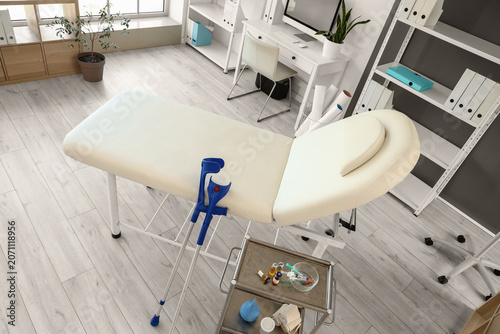 Interior of medical office with workplace and couch