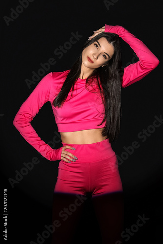 Young woman in sportswear e...