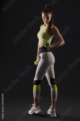 Sporty young woman exercisi...