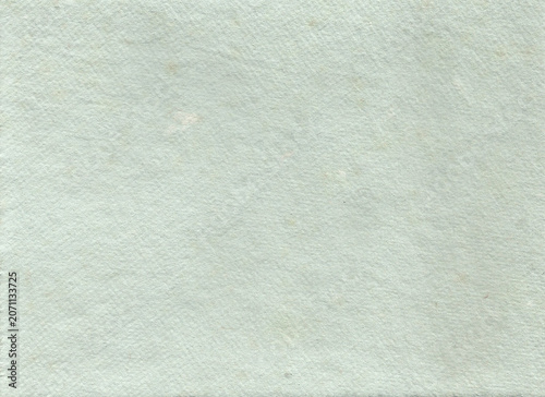 Organic muted pale mint green paper texture background highlighting a dense composition of natural handmade fibers. A soft earthy tone canvas ideal for elegant cosmetic packaging design.