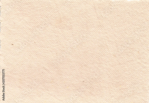 Bright clean pale peach cream handmade cotton rag paper texture with fine surface grain and tiny rustic imperfections. Beautiful luxury background template for wedding invitations, fine art prints.