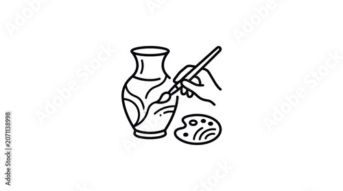 Hand holding paintbrush with vase palette.