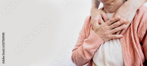 A close-up of a young person's hands gently comforting and showing love to an elderly woman. Symbolizing care, support, encouragement and mental health awareness.