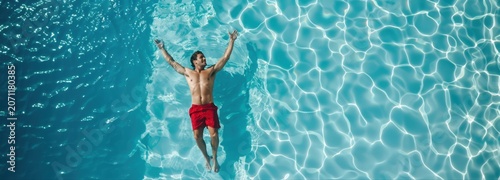 Serenity in the Pool: A man floats on his back in a pristine swimming pool, his arms outstretched as sunlight dances on the water's surface, evoking a feeling of pure relaxation and summer bliss.