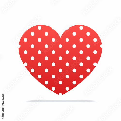 Red heart with white polka dots on white background